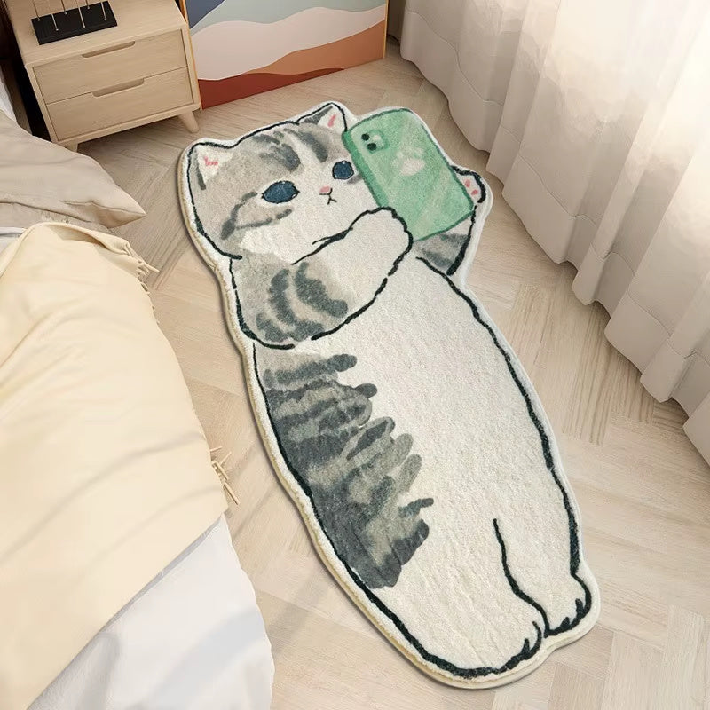 Cartoon cat shaped rug holding phone placed on bedroom floor beside bed, soft cute animal floor mat for kids room or modern decor