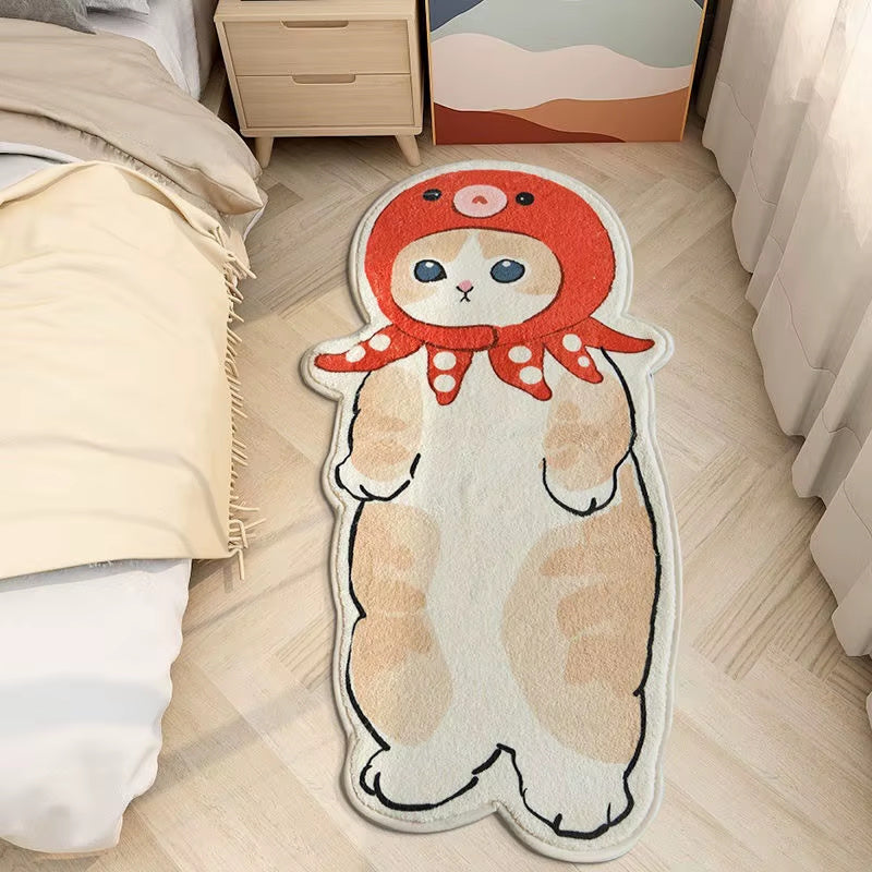 Cute cat shaped rug wearing red hood placed on bedroom floor beside bed, soft cartoon animal mat for kids room or cozy home decor