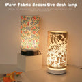 Floral fabric table lamp with warm soft glow next to modern textured lamp, cozy bedside desk lighting decor for bedroom and living room