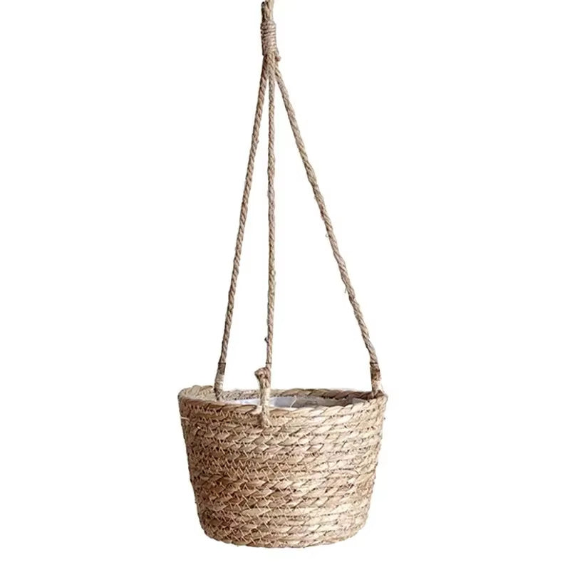 Woven hanging plant pot with rope on a white background