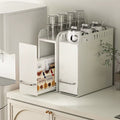 Pull-out countertop storage organizer holding cups, jars, and pantry items with sliding compartments.