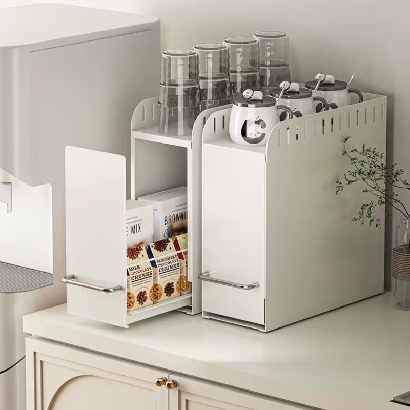 Pull-out countertop storage organizer holding cups, jars, and pantry items with sliding compartments.