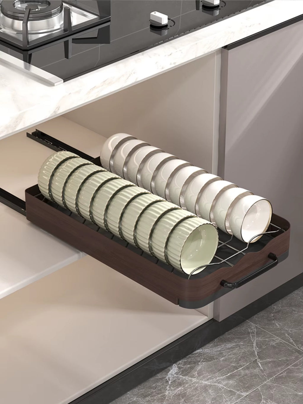 Pull-out cabinet dish rack organizer storing rows of bowls neatly arranged for easy access.