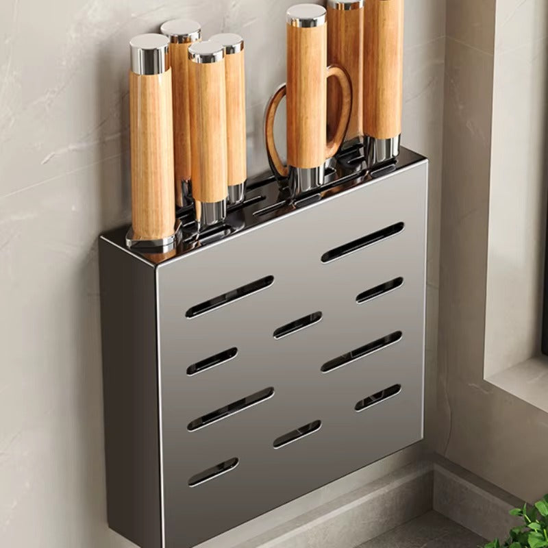 Wall-mounted stainless steel knife holder with wooden-handled knives neatly stored vertically.
